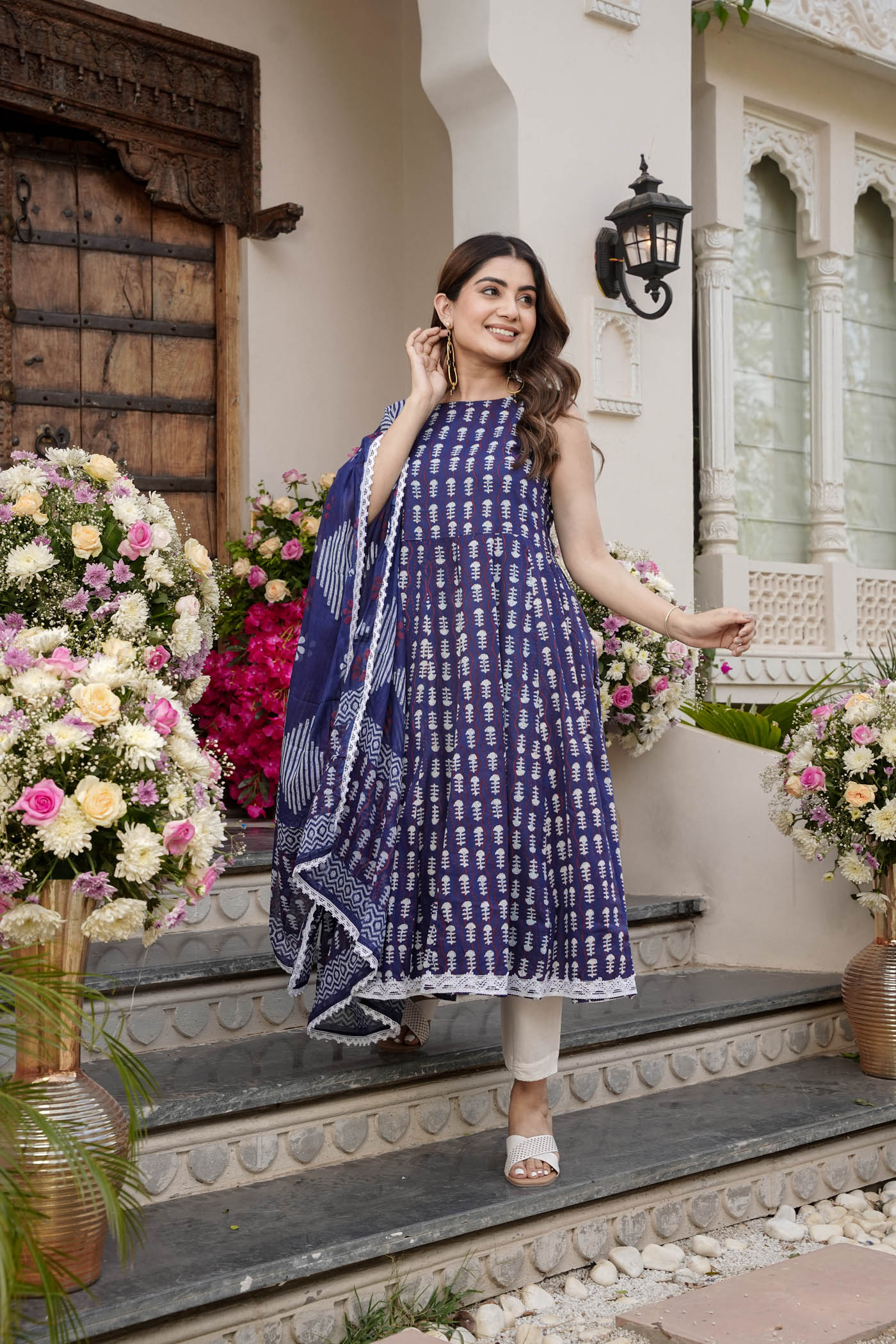 printed  sleeveless  anarkali  with printed  white  lace dupatta  and pant.